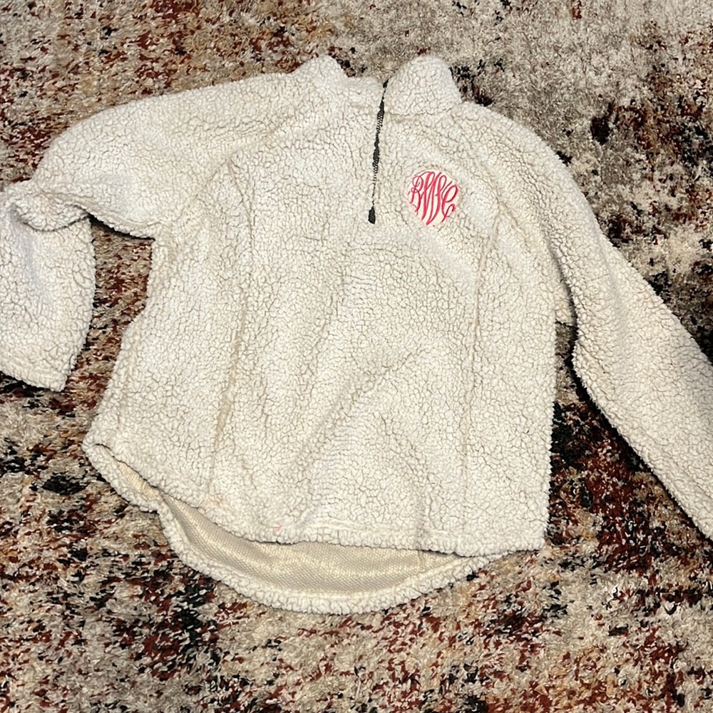 White furry pull over